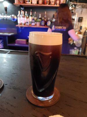 Perfect Guinness at the torch cigar pub .