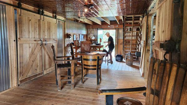 tasting room with owner in background