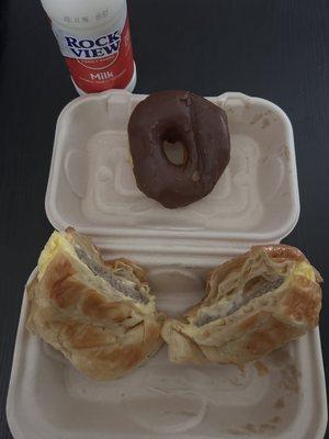 Sausage, Egg Croissant. Glazed chocolate covered donut. Rock View Whole milk.