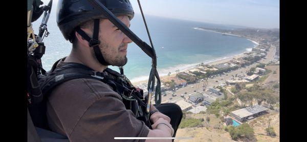 Happy customers paragliding in Malibu with Claude