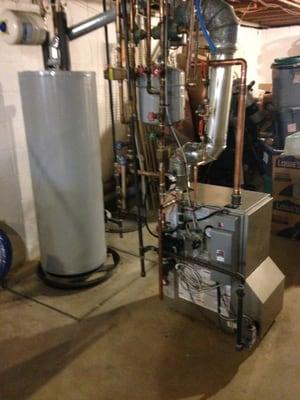 New Carrier gas heating boiler with new state 75 gallon hot water heater  house has 4 zone heat using taco zone valves and Honeywell progra.