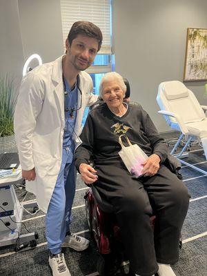 Our dentist with a happy patient. The skilled dentist and content patient share smiles