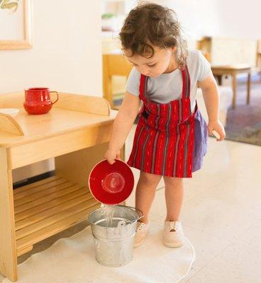 Toddlers (18 mths - 3 yrs) learn practical life skills like table setting, cleaning mirrors, polishing shoes, washing dishes, and more.