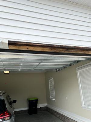 Garage door header was not house wrapped. Poor caulking allowed water to seep into area. Header is slowly rotting.