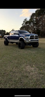 after a complete makeover, Fresh 22x14s on some 35s, powder coated whole underneath of the truck & tint & full interior and exterior detail