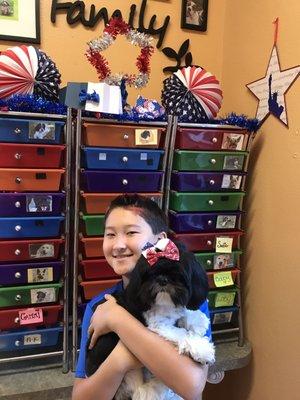 Mochi looks adorable with her red, white, and blue hair clips.