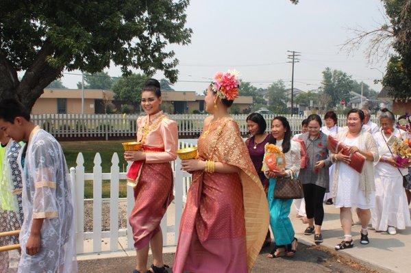 Parade of candles for offer to monks to use in Buddhist lent period