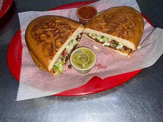 Torta Mexicana with your choice of our really spicy red sauce or just spicy green sauce!