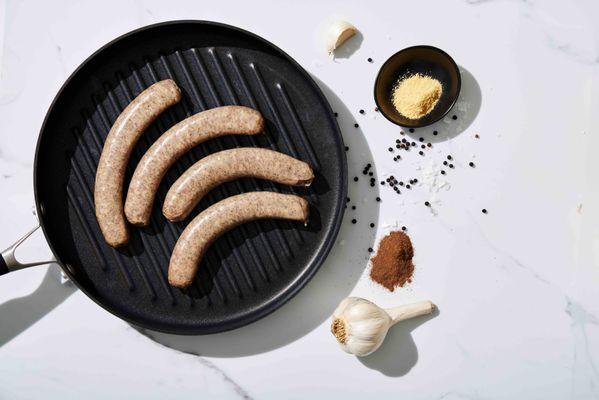 BRATWURST: A classic bratwurst mixed with mustard powder, white pepper, mace and our own signature blend of spices.