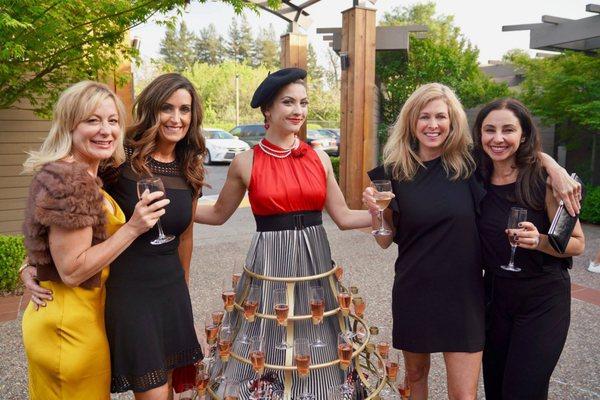 Ladies toasting in the courtyard at the 4 Cs of Sonoma county's event