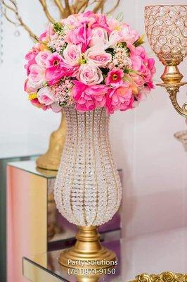 gold vase with artificial arrangements