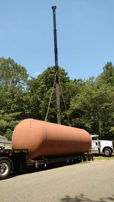 New 20000 gallon tank being lifted off its truck