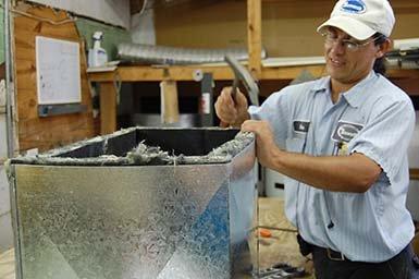 Alex fabricating a return air supply can.