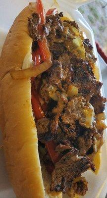 Philly cheese steak. 8inch sub roll filled with ribeye, bell peppers, onion, mushroom, covered in provolone cheese.