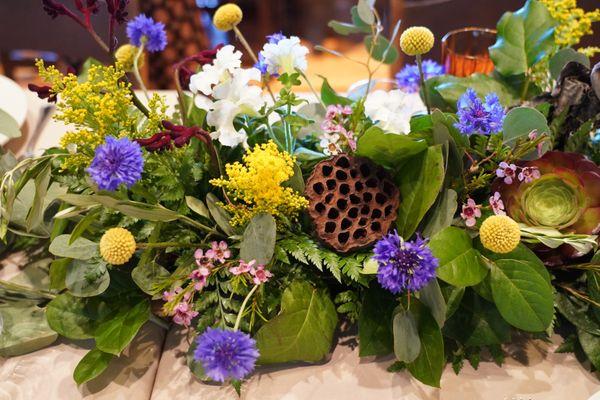 Gorgeous floral centerpieces for our forest-themed event. Stunning!