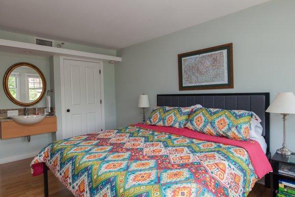 Bedroom with TV and Sink