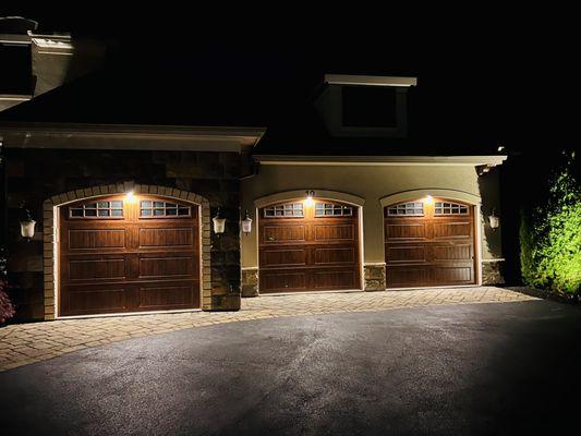 Garage door lighting. Lights the size of a quarter, mounted in the door frame.