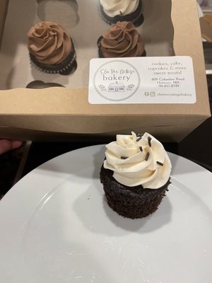 Chocolate cupcake with vanilla buttercream frosting and sprinkles