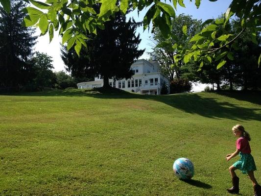 Breezy Point's Big Hill looking up to Main House Nursery School.