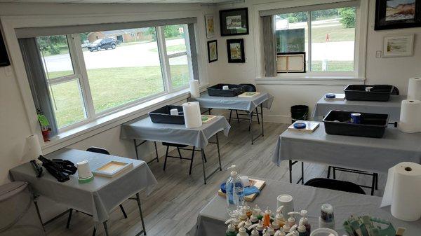 Classroom, now spaced out, and dividers between students.