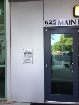 This parking sign is next to the main entrance...not visible from vehicles pulling into the lot. So you see this after parking.