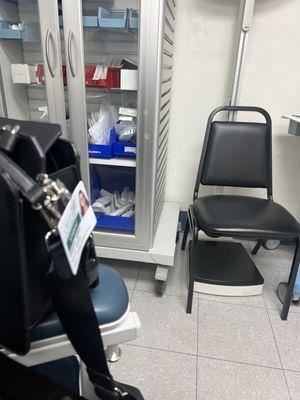 Open medicine cabinet with needles, syringes, and vials of medicine