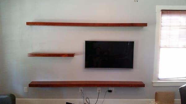 Custom built floating shelves using poplar and birch with a gun stock finish