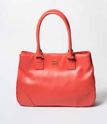 A few of our favorite past items... A Tory Burch Robinson double zip tote in coral.