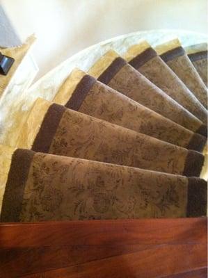 Stanton print carpeting with a solid border.