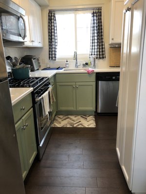 Can see the white and green cabinets here