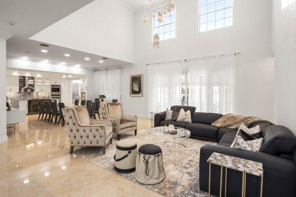 custom living room with american leather sectional, vanguard chairs, gamma poufs.