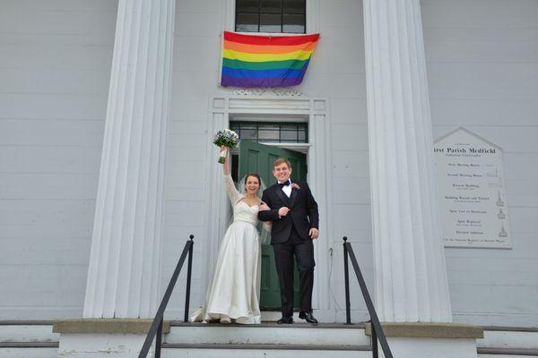 Newly married couple out on the church steps