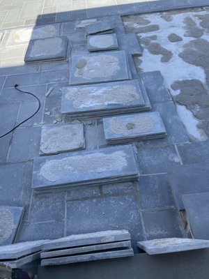 This slate has been removed because they did not put mortar on the entire bottom of the slate pieces.  Another contractor had to repair it.