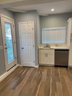 Tempered glass entry door, drywall closet, quartz counter with sink, under counter fridge, pantry.  New cabinets, floors and paint!