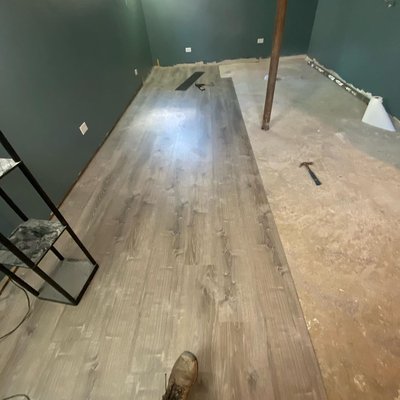 Here we have a job in progress, but you can already tell how much a difference the new flooring makes.