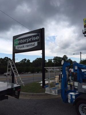 CLOSER VIEW OF NEW SIGN FACES INSTALLED ALONG WITH FRESHLY PAINTED POLES.