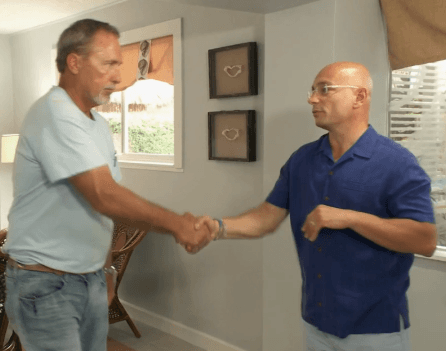 Sammy Sparks (left) of ST Sparks Construction is congratulated for a job well done by Hotel Impossible host Anthony Melchiorr...