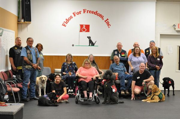 Service Dog Teams, Service Dog Trainers, and volunteers with the Vietnam veterans club, Nam Knights.