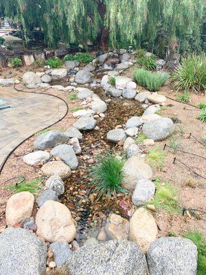 Backyard pondless with paver stone decking