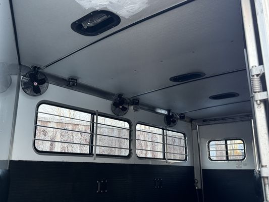 Electric fans and cameras installed on a gooseneck trailer