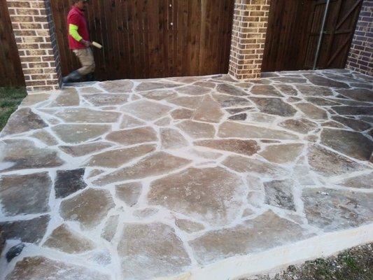 Flagstone cover ovet existing patio with mortar mix underneath