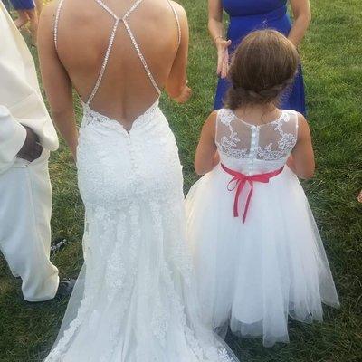 Flower Girl, Bride back and Groom on left. We do alterations for all sizes