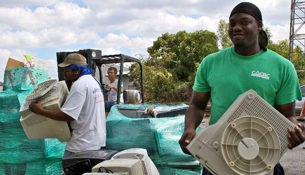 Our crew members, working hard to collect and distribute items during an E-RECYCLING event.