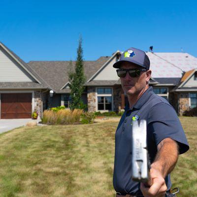 Production Manager, Cerby N, overseeing a roofing job in Des Moines, Iowa.