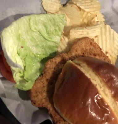 Pork tenderloin sandwich with chips