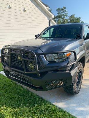 Grille guard with bumper, and ditch lights.