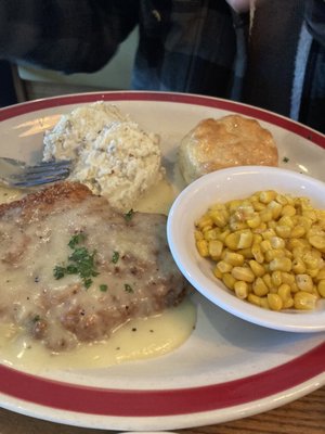 Country fried chicken, mashed potatoes, corn in a biscuit