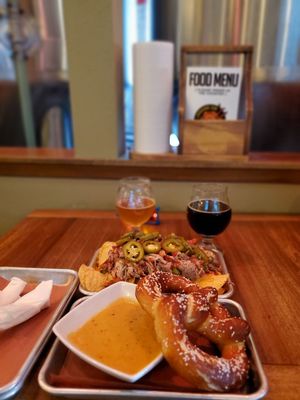 Pretzel with beer cheese dipping sauce and Pulled Pork Naches