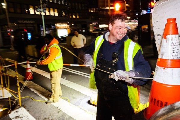 HOK nyc telecom infrastructure electrical installation 5g wifi network Manhattan crew laying out cables subcontractors