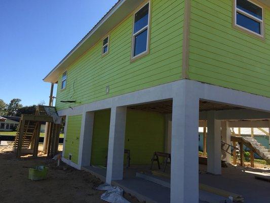 Painting stilt home on canal in Crystal River